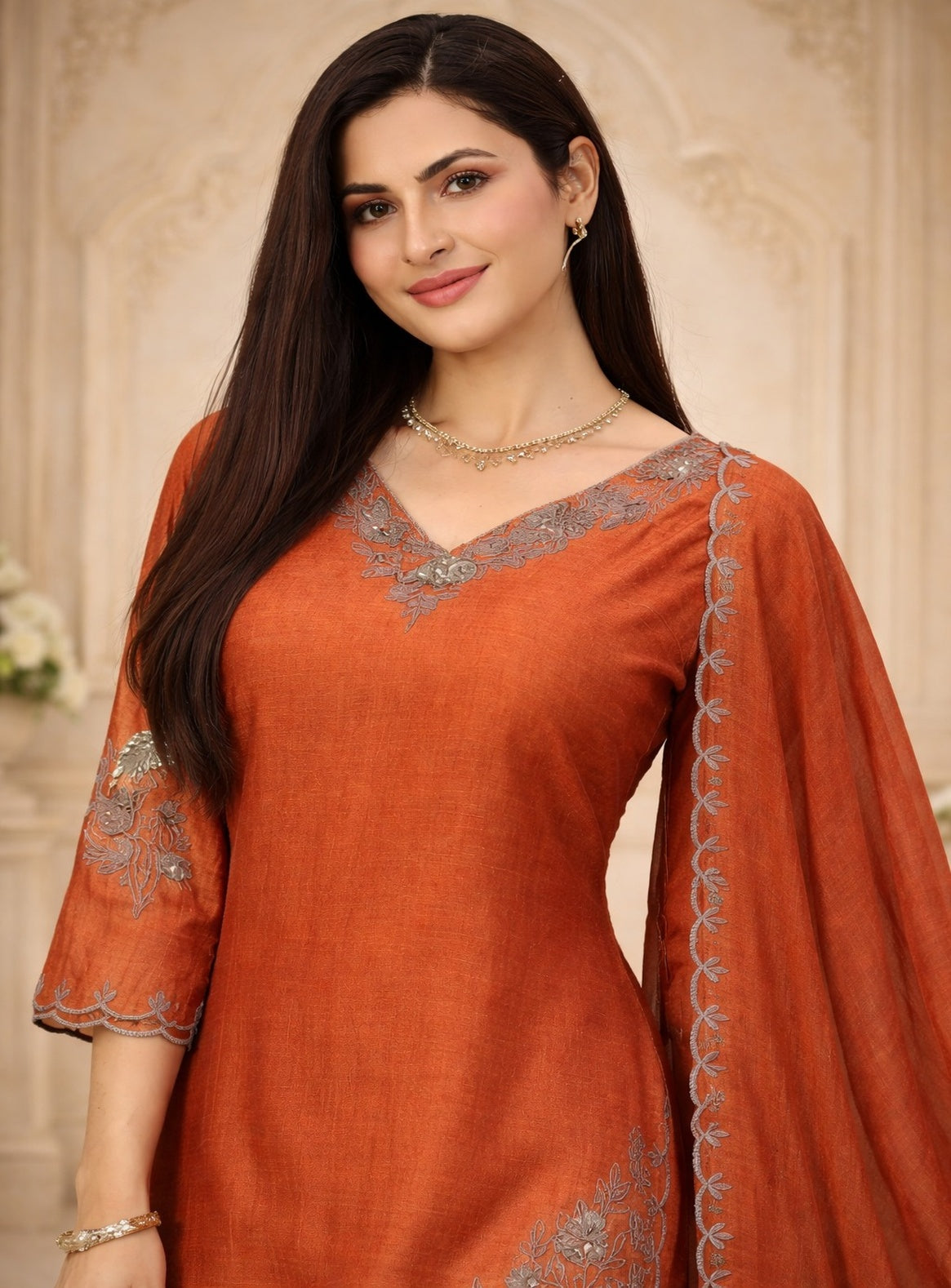 Green and orange kurta set with neck embrodery